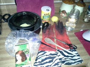 Tools and ingredients for mixing and applying henna.